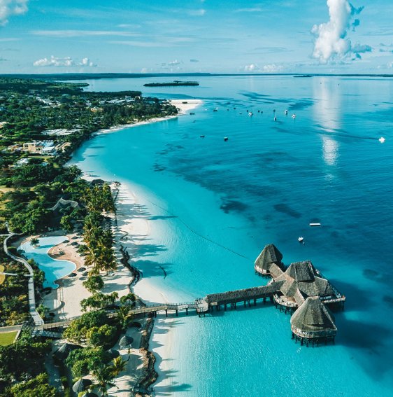 Aerial view of an overwater lodge on the Zanzibar coastline
